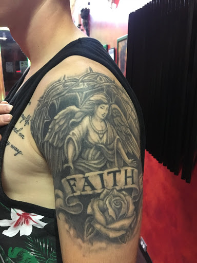 Explore red string tattoo ideas, creative tattoo ideas in Amityville, available at Tattoo Frenzy Inc