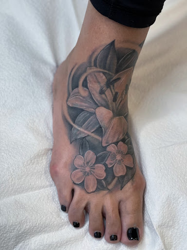 Explore script tattoo ideas for guys, creative tattoo ideas in New Orleans, available at Downtown Tattoos and Piercing