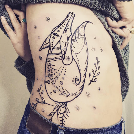 Explore shark tooth tattoo ideas, creative tattoo ideas in Fort Collins, available at Meadowlark Tattoo