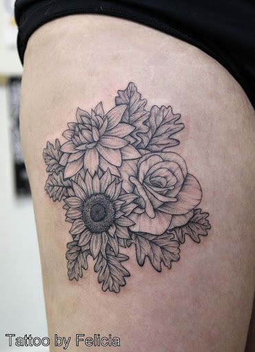 Explore garter tattoo ideas, creative tattoo ideas in Fort Myers, available at Tiger Lotus Tattoo and Piercing