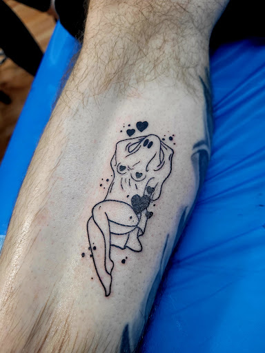 Explore back shoulder tattoo ideas, creative tattoo ideas in Benton, available at Spectrum Tattoo