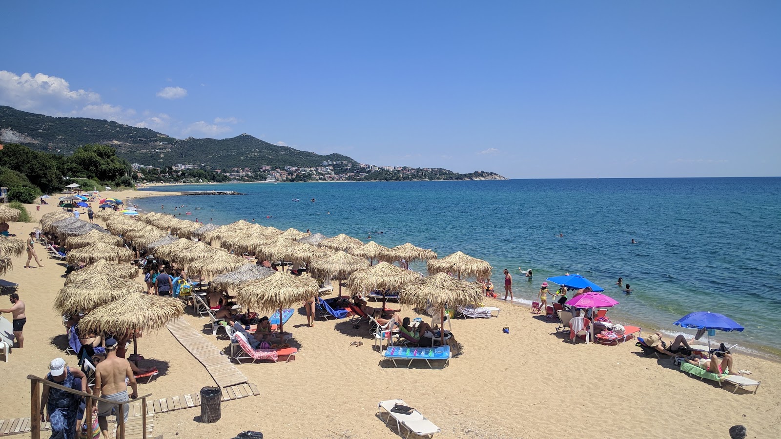 Foto di Tiho beach con una superficie del sabbia beige