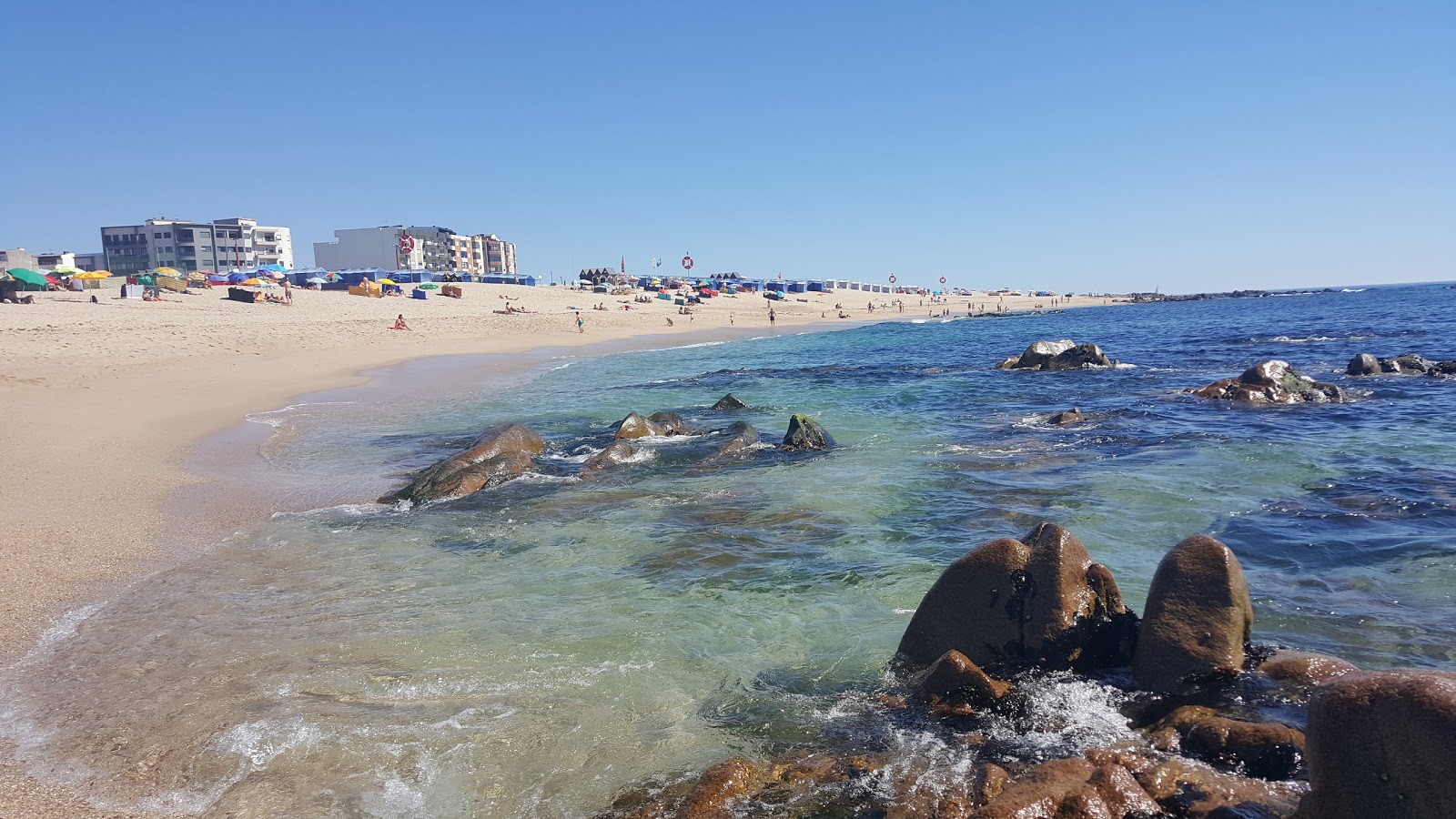 Fotografie cu Praia de Coim cu o suprafață de nisip beige