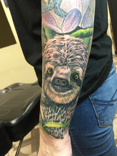 Explore women's half sleeve tattoo ideas, creative tattoo ideas in Jacksonville, available at Electric Legacy Tattoo