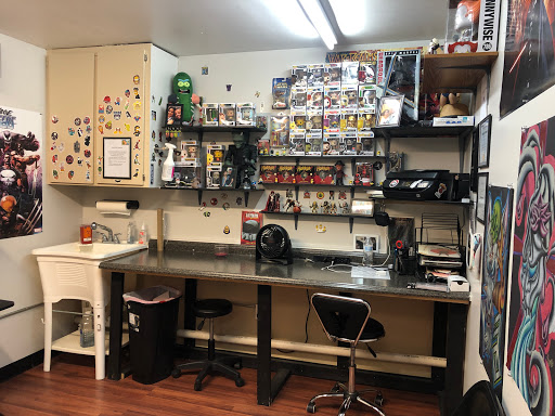 Explore dark sleeve tattoo ideas, creative tattoo ideas in Alamosa, available at The Shop Tattoo & Comics