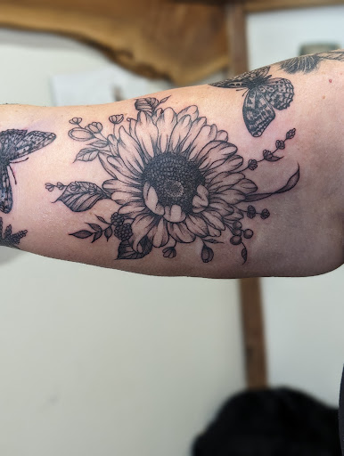 Explore purple tattoo ideas, creative tattoo ideas in Cornelia, available at Prismatic Pulse Tattoo