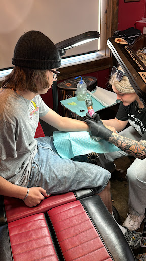 Explore cross tattoo ideas for women, creative tattoo ideas in Dallas, available at Lamar Street Tattoo Club