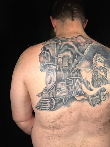 Explore back hand tattoo ideas, creative tattoo ideas in Eugene, available at Whiteaker Tattoo Collective