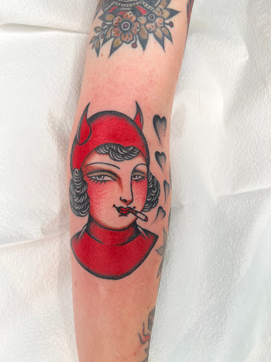 Explore joker hand tattoo ideas, creative tattoo ideas in Portland, available at Scapegoat Tattoo