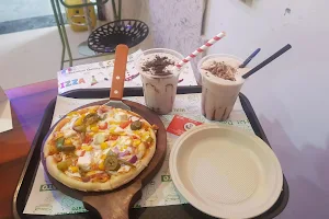 We Desi Pizza and Shakes image
