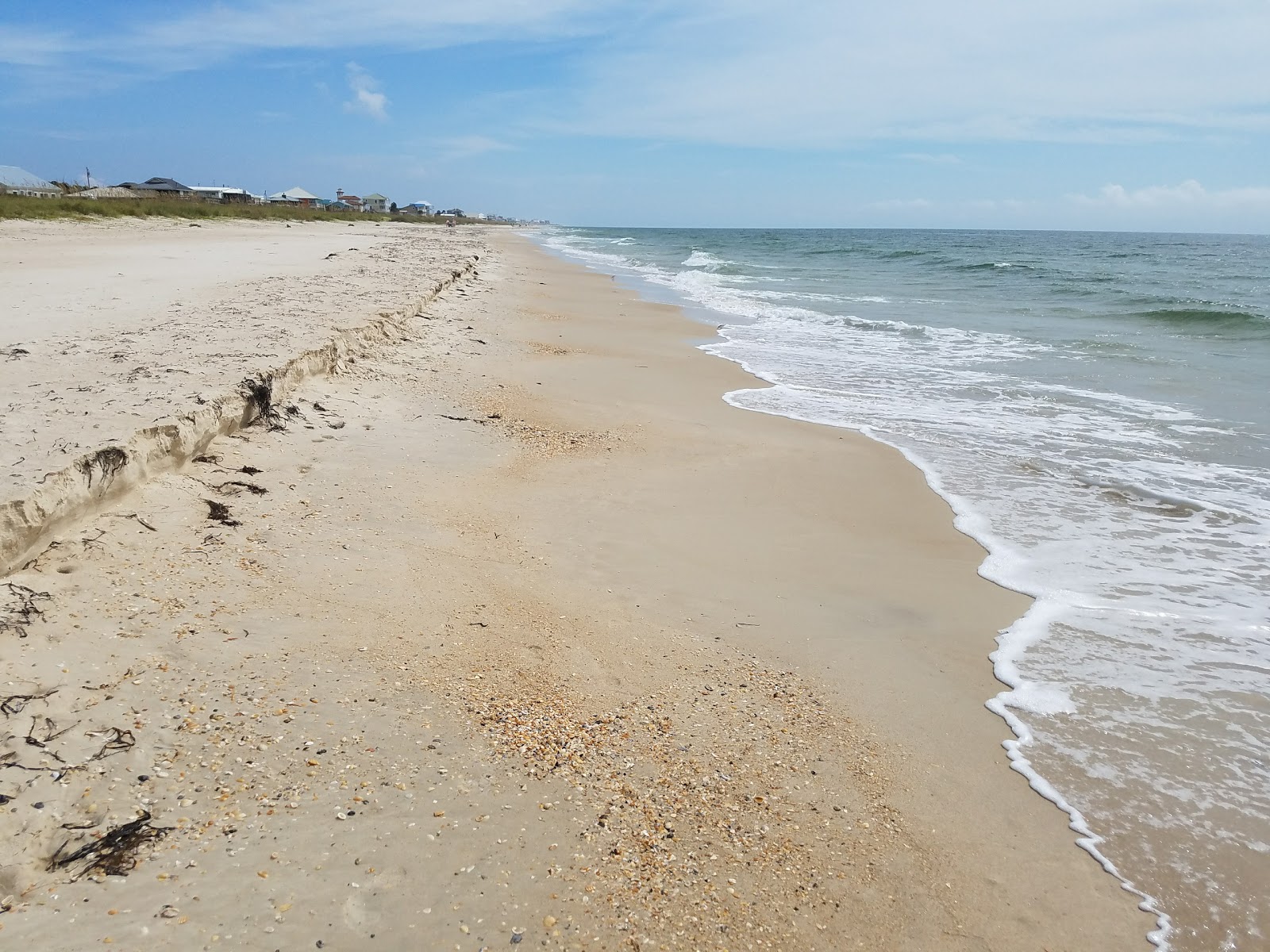 Photo of St. George Lighthouse Beach with long straight shore