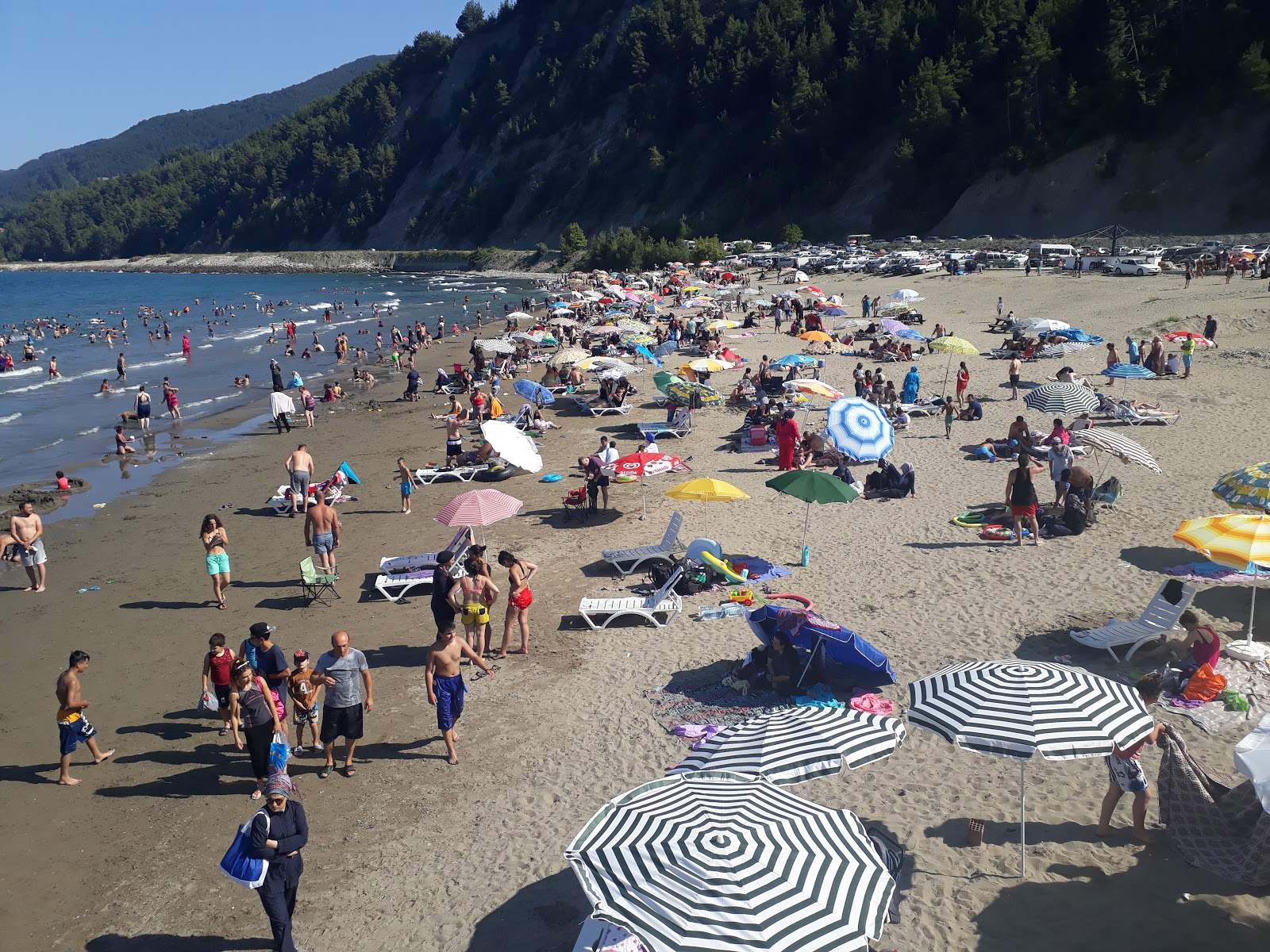 Foto di Ginolu Plaji con una superficie del sabbia beige