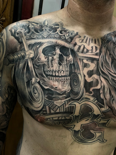 Find garter belt tattoo ideas for your next unique tattoo in Fountain Valley at Lowrider Tattoo Studios