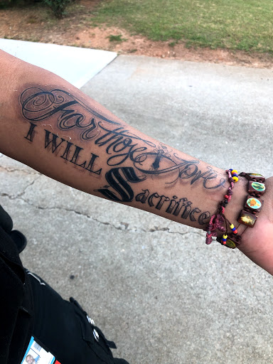 Explore back hand tattoo ideas, creative tattoo ideas in Wake Forest, available at Revelation Ink Tattoo and Piercing