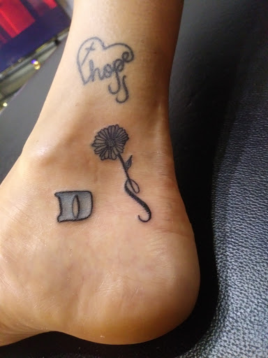 Find women's rib tattoo ideas for your next unique tattoo in Kennewick at Luxurious Life Tattoo