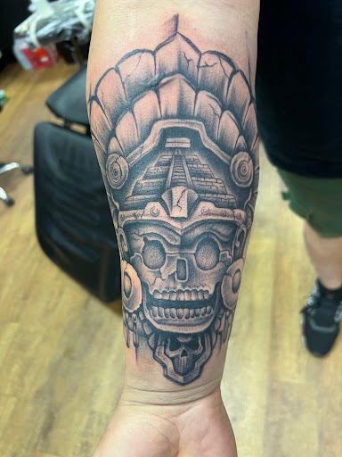 Explore tattoo ideas for women's legs, creative tattoo ideas in Whiteville, available at Coup de Gras 2.0 Tattoo and Body Piercing