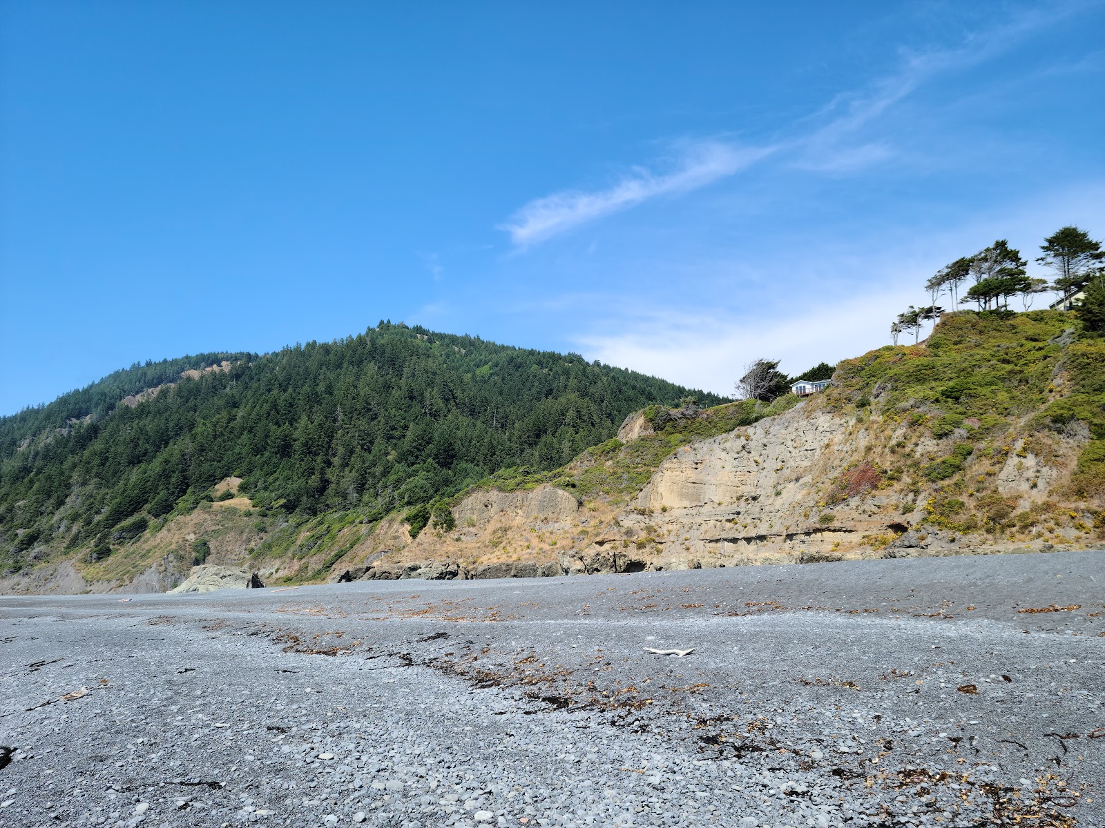 Photo of Black Sands Beach and the settlement