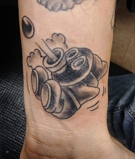 Explore red hand tattoo ideas, creative tattoo ideas in Savannah, available at Tattoo Addictions