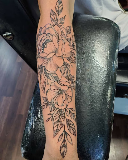 Explore kiss tattoo ideas, creative tattoo ideas in Reno, available at Evolution Tattoo