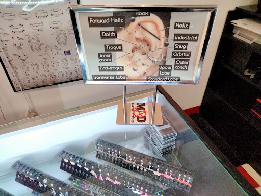 Explore barbie movie tattoo ideas, creative tattoo ideas in Peoria, available at Mad Tattoo and Piercing