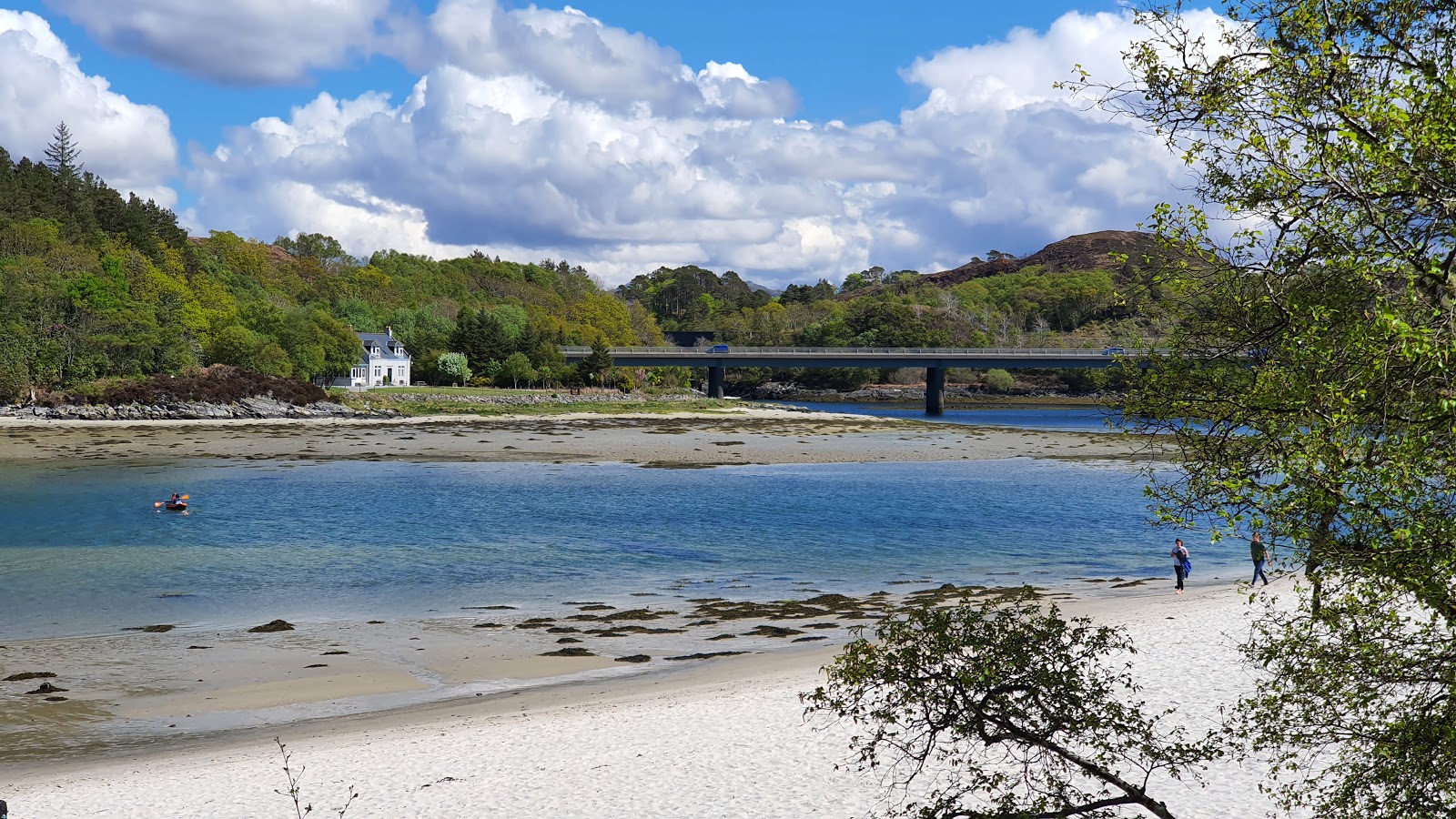Photo of Silver Sands of Morar backed by cliffs