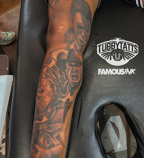 Explore wedding ring tattoo ideas for men, creative tattoo ideas in Hammond, available at Famous Ink, Inc.