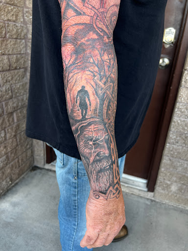 Explore hand tattoo ideas for guys, creative tattoo ideas in Elko, available at Freedom Tattoo
