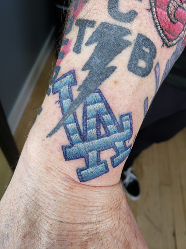 Explore small back tattoo ideas, creative tattoo ideas in Traverse City, available at Black Candle Tattoo Co.