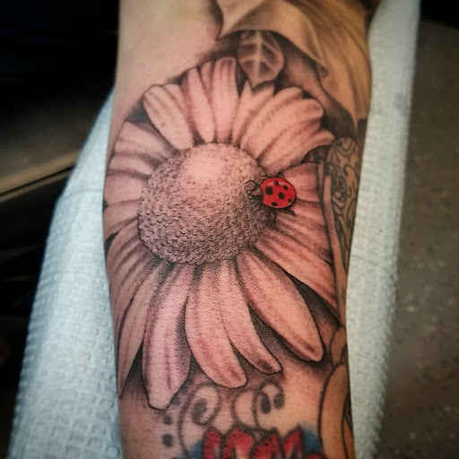 Explore angel halo tattoo ideas, creative tattoo ideas in Clayton, available at Black Pearl Tattoo Company