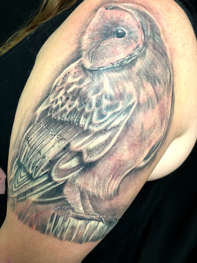 Explore hands tattoo ideas, creative tattoo ideas in Greenfield, available at Tattoos In Time Studio