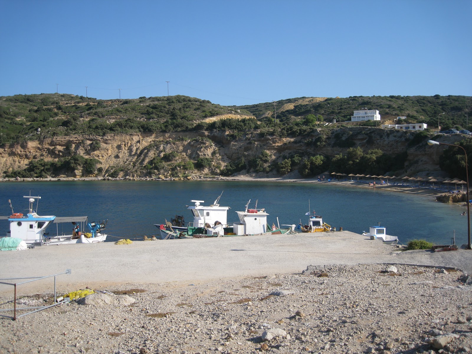 Photo of Limnionas beach backed by cliffs