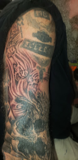 Find under the breast tattoo ideas for your next unique tattoo in Toledo at Artistik Tat2 and Body Piercing