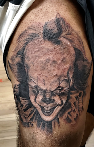 Explore red ink tattoo ideas for guys, creative tattoo ideas in Fresno, available at Happy Client Tattoo