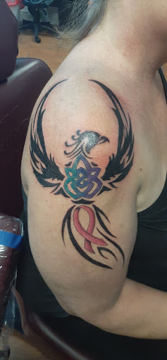 Explore dinosaur tattoo ideas, creative tattoo ideas in Stuart, available at Tiger Shark Tattoo Studio