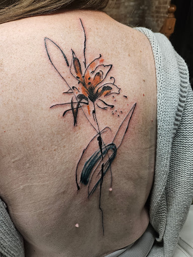 Explore dragonfly flower tattoo ideas, creative tattoo ideas in Bloomsburg, available at Tuccis Tattoo & Piercings Studio