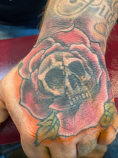 Explore dark skin male black skin tattoo ideas, creative tattoo ideas in Pikeville, available at The Carbon Canary Tattoo Studio
