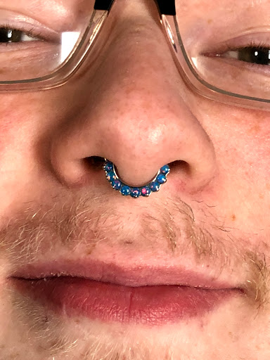 Explore ankle chain tattoo ideas, creative tattoo ideas in Bloomington, available at Evil by the Needle Custom Tattoo and Piercing Studio