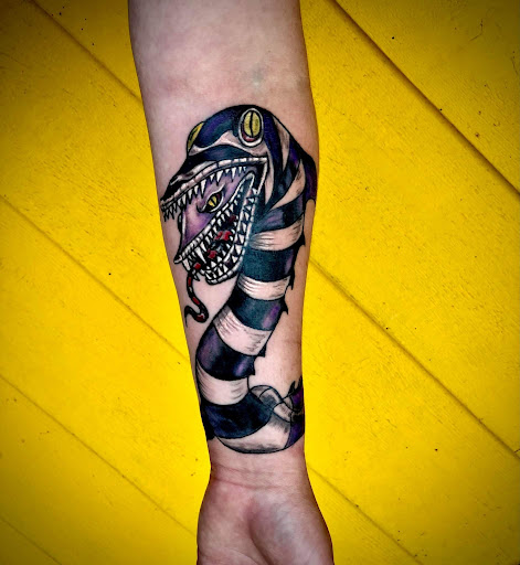 Explore lower back tattoo ideas for females, creative tattoo ideas in Minocqua, available at Family Tradition Tattoo Co.