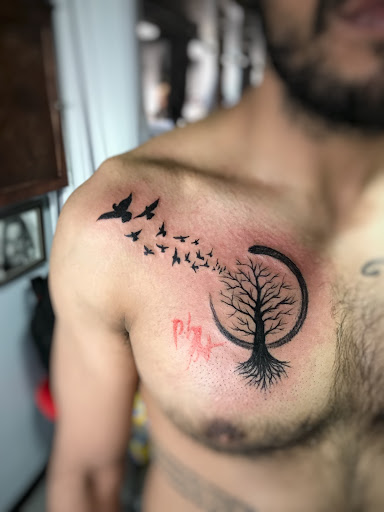Explore upper chest tattoo ideas, creative tattoo ideas in Carmel, available at Phong Tattoo