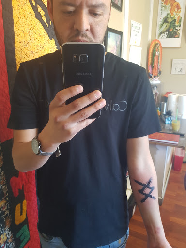 Explore sternum tattoo ideas for females, creative tattoo ideas in Boise, available at Ikon Tattoo and Body Piercing