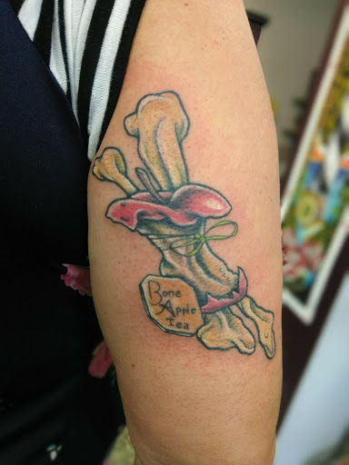 Explore dystopian tattoo ideas, creative tattoo ideas in Covington, available at Cupid Slave Tattoo Company