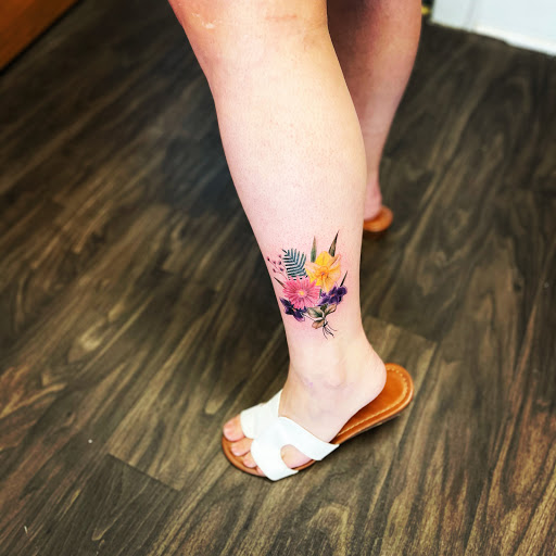 Explore bird cage tattoo ideas, creative tattoo ideas in Belmont, available at The Body Art Gallery