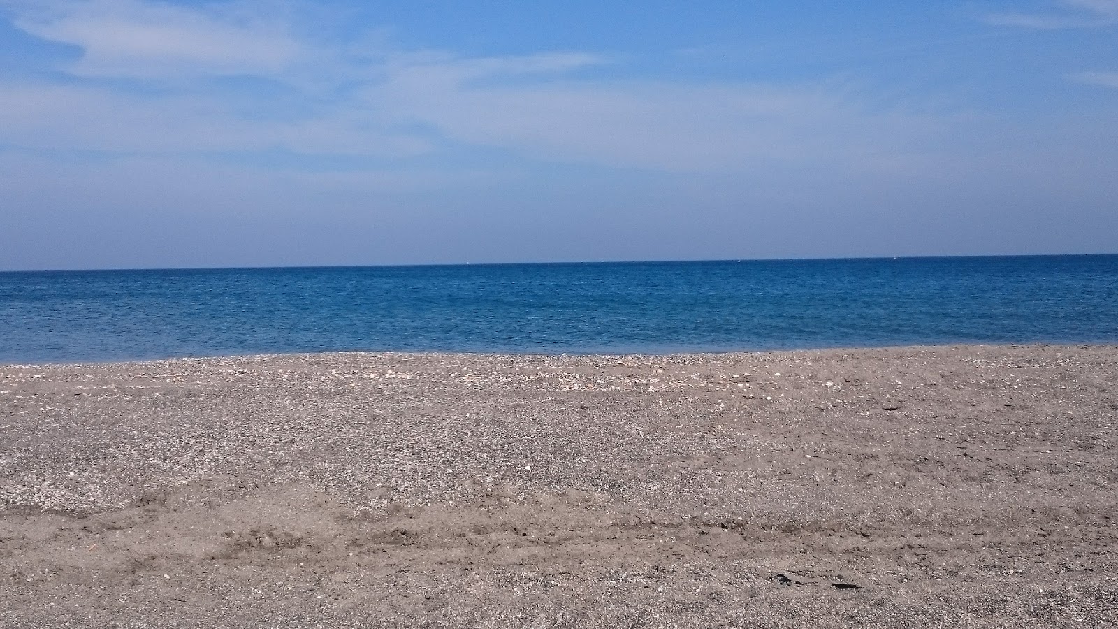 Foto von Playa del Burgo und die siedlung