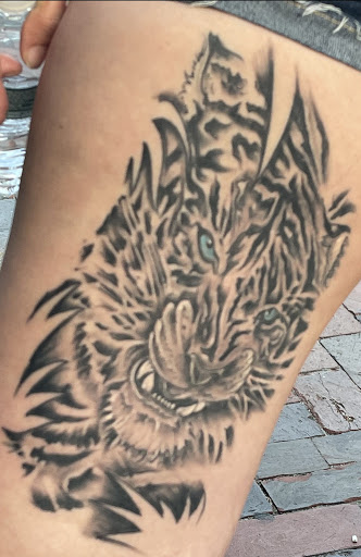 Explore mens back shoulder tattoo ideas, creative tattoo ideas in Old Orchard Beach, available at Mad Hatters Tattoo Studio