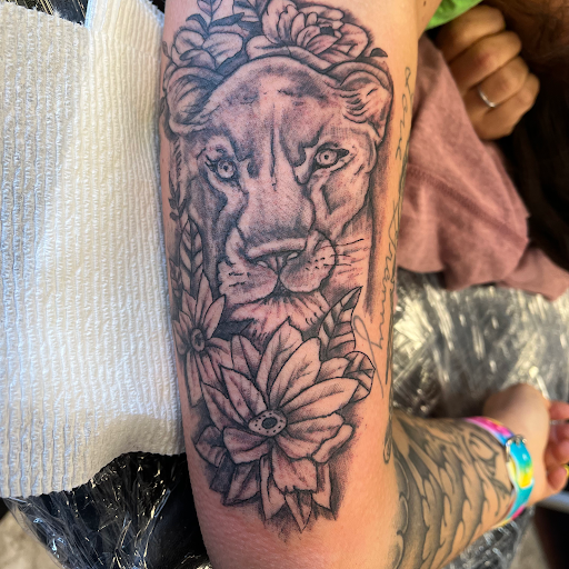 Explore sleeve tattoo ideas for females, creative tattoo ideas in Seymour, available at American Gypsy Tattoo Corp.