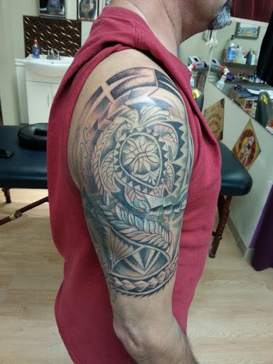 Find dragon arm tattoo ideas for your next unique tattoo in La Crosse at La Crosse Tattoo