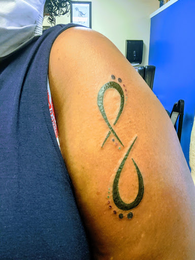 Explore lily flower tattoo ideas, creative tattoo ideas in Orange Beach, available at Orange Beach Tattoos