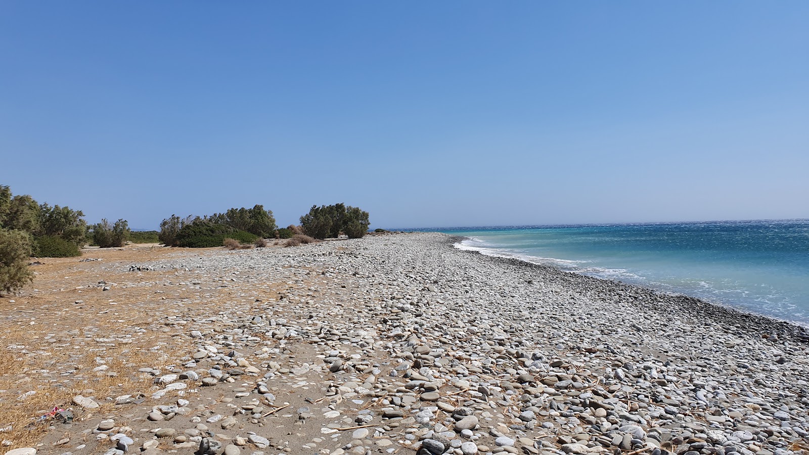 Photo of Dermatos beach with turquoise pure water surface