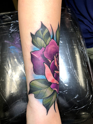 Explore flower vine tattoo ideas, creative tattoo ideas in Englewood, available at Point of Entry Tattoo