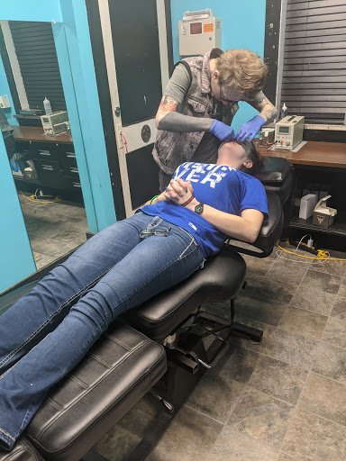 Explore belly button tattoos ideas, creative tattoo ideas in Council Bluffs, available at Lil Bros Tattoo